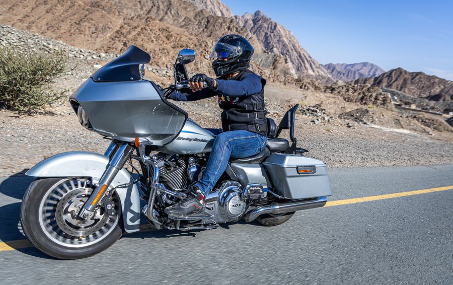 Silver Harley-Davidson Road Glide cruising a mountain highway