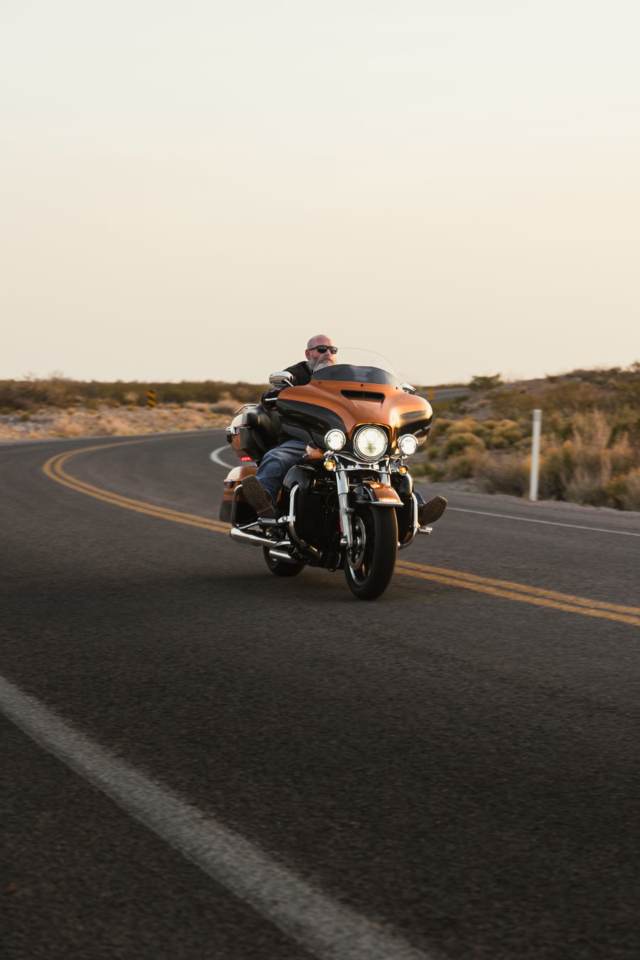 Harley-Davidson Electra Glide touring bagger on an open desert road